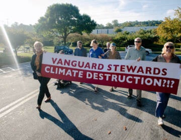 File photo: Climate activists with the Earth Quaker Action Team protest Vanguard's fossil fuel investments at their headquarters in Malvern. Eight people who sought to meet with an executive were arrested after refusing to leave and charged with misdemeanor defiant trespass. (Courtesy of Earth Quaker Action Team)