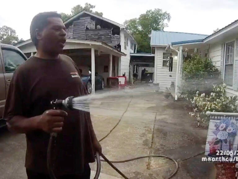 This image captured from bodycam video released by the Childersburg (Ala.) Police Department and provided by attorney Harry Daniels shows Michael Jennings, left, in custody in Childersburg, Ala., on May 22. Jennings was helping out a friend by watering flowers when officers showed up and placed him under arrest within moments. This image captured from bodycam video released by the Childersburg (Ala.) Police Department and provided by attorney Harry Daniels shows Michael Jennings, left, in custody in Childersburg, Ala., on May 22. Jennings was helping out a friend by watering flowers when officers showed up and placed him under arrest within moments. (Childersburg Police Department via AP)