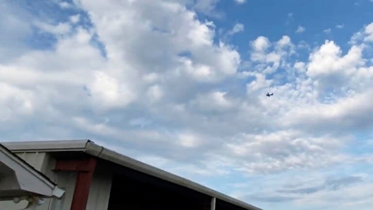 A small airplane circles over Tupelo, Miss., on Saturday. Police say the pilot threatened to crash the aircraft into a Walmart. A small airplane circles over Tupelo, Miss., on Saturday. Police say the pilot threatened to crash the aircraft into a Walmart. (Rachel McWilliams/AP)