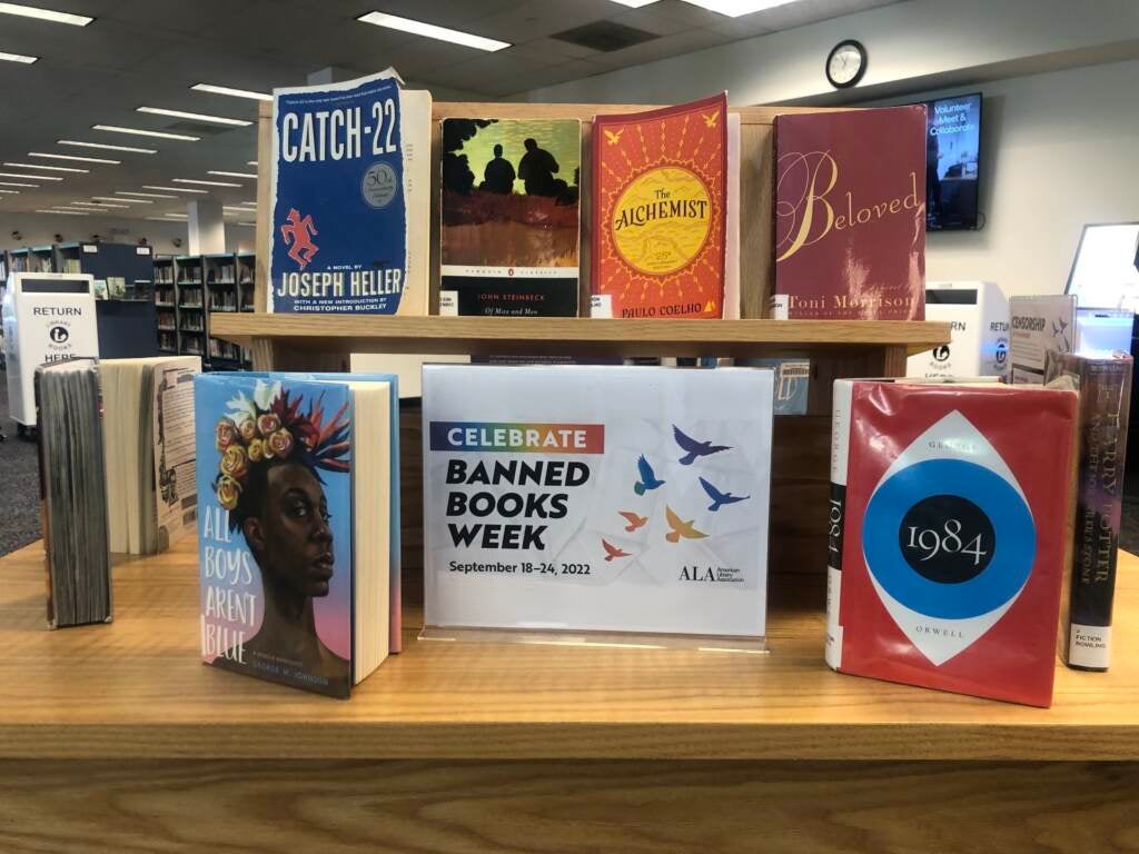 Books are displayed around a sign that reads Celebrate Banned Books Week.
