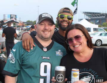 Shawn Coey, Kristopher Powell, and Jenna Boone enjoyed the sights and sounds of an Eagles tailgate ahead of Monday night's home opener against the Vikings. (Cory Sharber/WHYY)