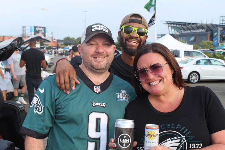 Shawn Coey, Kristopher Powell, and Jenna Boone enjoyed the sights and sounds of an Eagles tailgate ahead of Monday night's home opener against the Vikings. (Cory Sharber/WHYY)