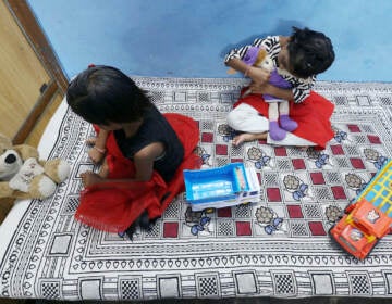 Tripti and Pari play at a relatives home in India