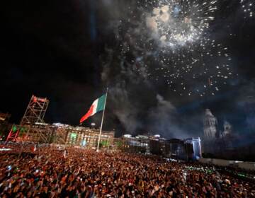 Fireworks soar over the National Palace Thursday night to mark the start of Independence Day celebrations in Mexico City. (Alfredo Estrella/AFP via Getty Images)