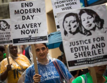 Activists march toward the German consulate during a rally to support two Filipina domestic workers in their lawsuit against a German diplomat. (Drew Angerer/Getty Images)