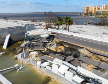 An aerial view of a causeway damaged by Hurricane Ian.
