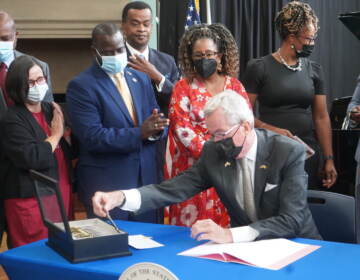 Gov. Phil Murphy signed a law on Sept. 7, 2022 establishing the New Jersey Black Heritage Trail and Commission. The signing happened at the Newark Public Library. (Tennyson Donyéa / WHYY)