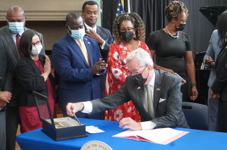 Gov. Phil Murphy signed a law on Sept. 7, 2022 establishing the New Jersey Black Heritage Trail and Commission. The signing happened at the Newark Public Library. (Tennyson Donyéa / WHYY)