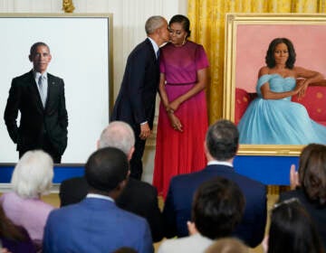 Former President Barack Obama kisses his wife former first lady Michelle Obama after they unveiled their official White House portraits during a ceremony for the unveiling in the East Room of the White House, Wednesday, Sept. 7, 2022, in Washington. (AP Photo/Andrew Harnik)