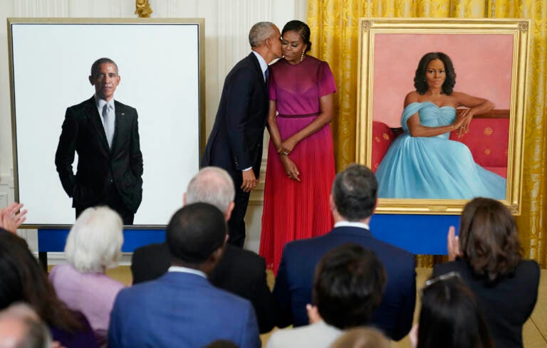 Former President Barack Obama kisses his wife former first lady Michelle Obama after they unveiled their official White House portraits during a ceremony for the unveiling in the East Room of the White House, Wednesday, Sept. 7, 2022, in Washington. (AP Photo/Andrew Harnik)