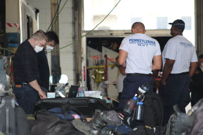 Pennsylvania Task Force 1 gets their equipment ready ahead of deploying to South Carolina to aid potential victims of Hurricane Ian on Sep. 28, 2022. (Cory Sharber / WHYY)