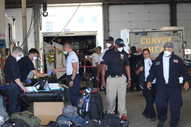 Pennsylvania Task Force 1 gets their equipment ready ahead of deploying to South Carolina to aid potential victims of Hurricane Ian on Sep. 28, 2022. (Cory Sharber / WHYY)
