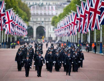 Police officers take positions ahead of the Queen Elizabeth II funeral in central London
