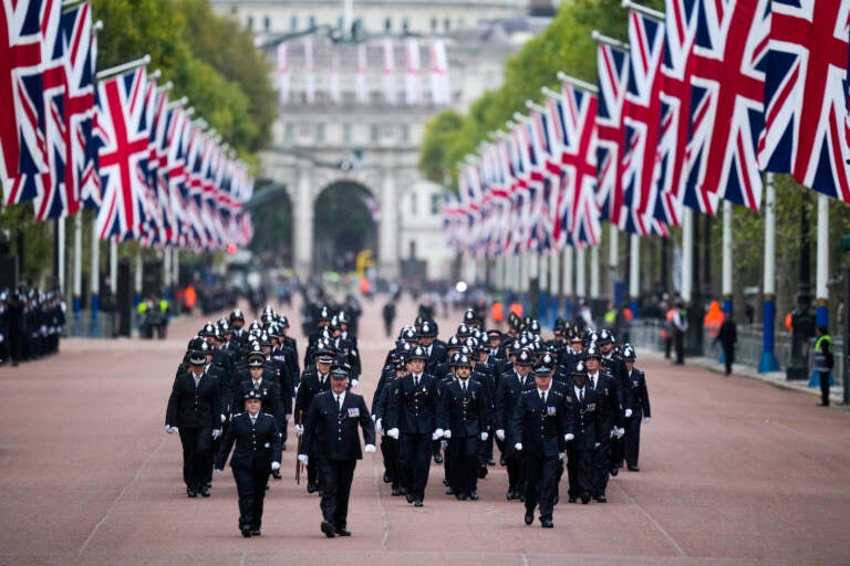 Police officers take positions ahead of the Queen Elizabeth II funeral in central London