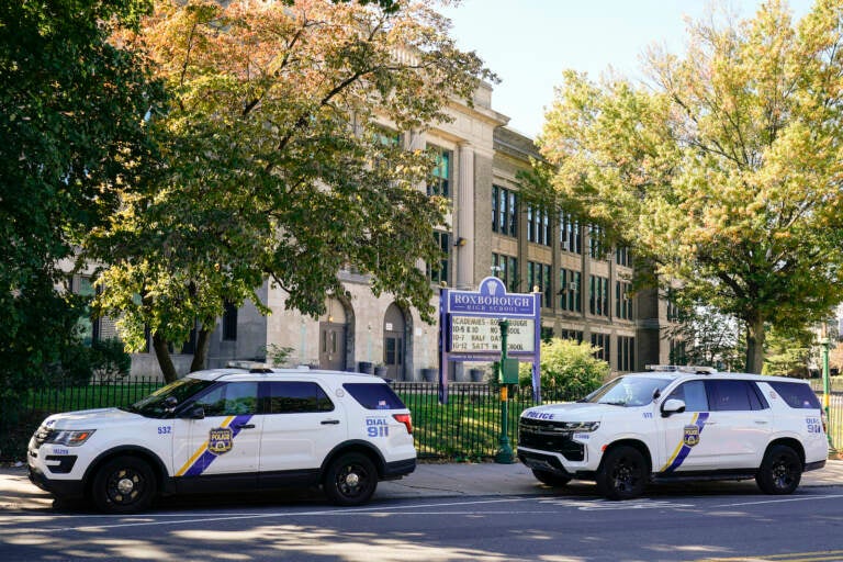 Police vehicles are parked at Roxborough High School