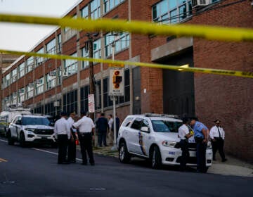 Investigators work the scene where multiple people were shot near a high school in Philadelphia