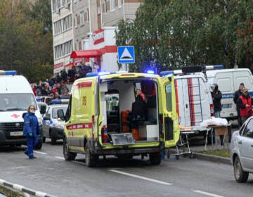 Police and paramedics work at the scene of a shooting at school No. 88 in Izhevsk