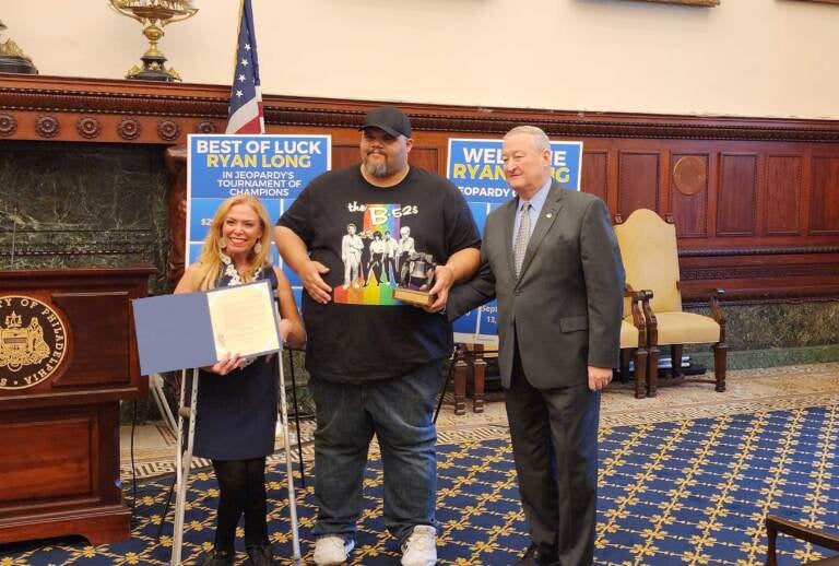 Jeopardy! champion Ryan Long was presented with a ceremonial model of the Liberty Bell at City Hall on September 13, 2022. (Tom MacDonald / WHYY)