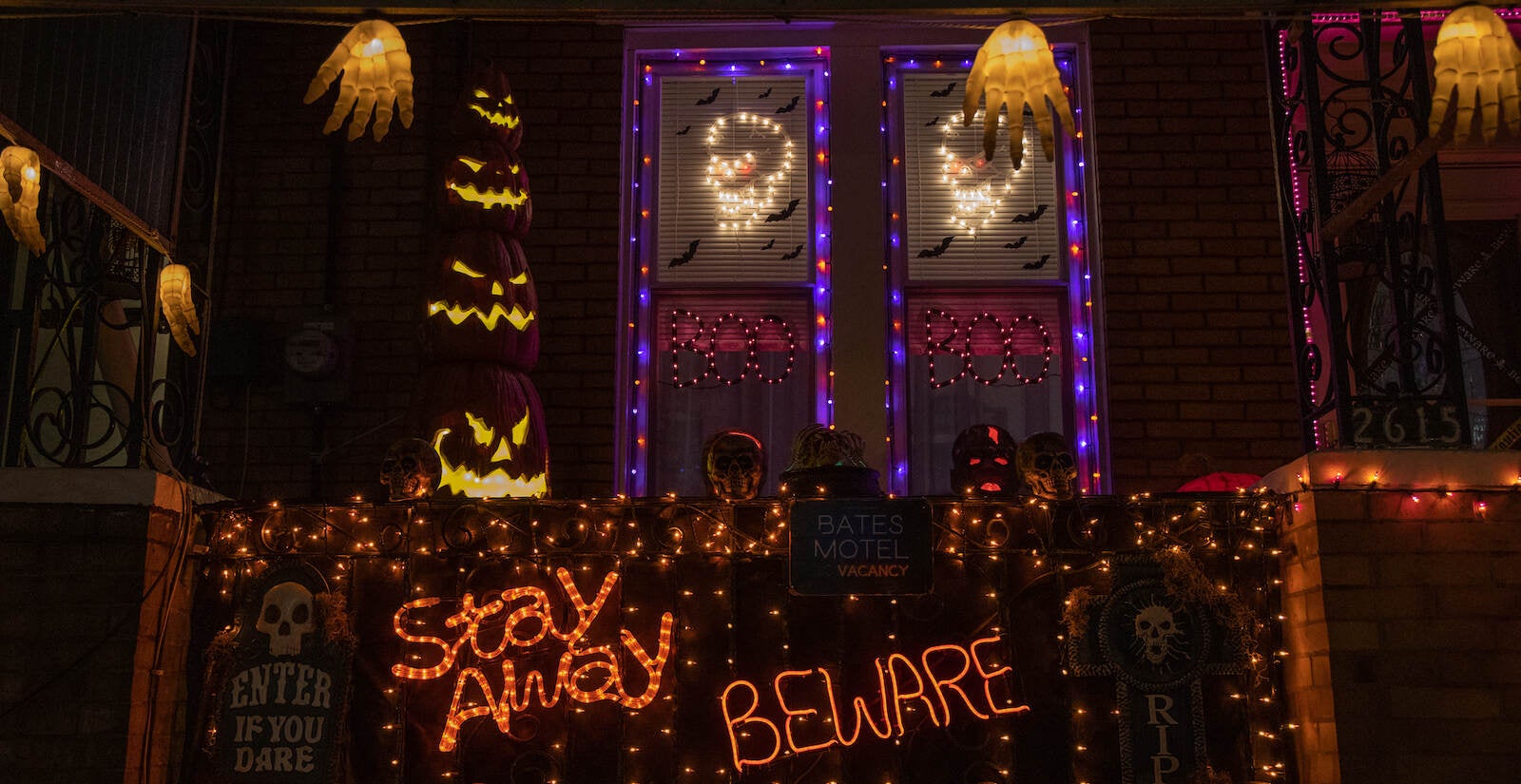 A Halloween display lights up to read, ''Stay away'' and ''Beware''