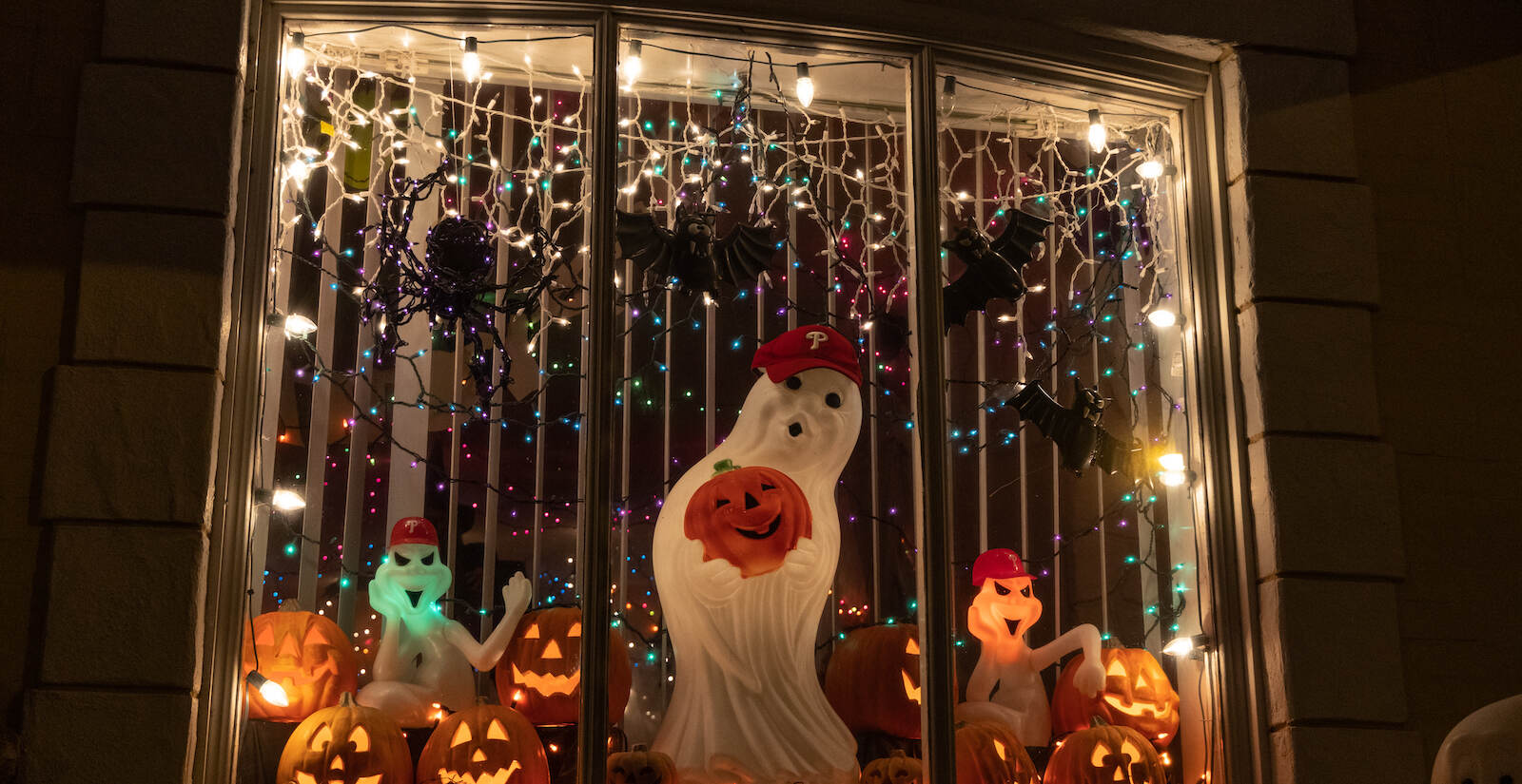 Ghosts wearing Phillies hats are seen in a Philadelphia window display