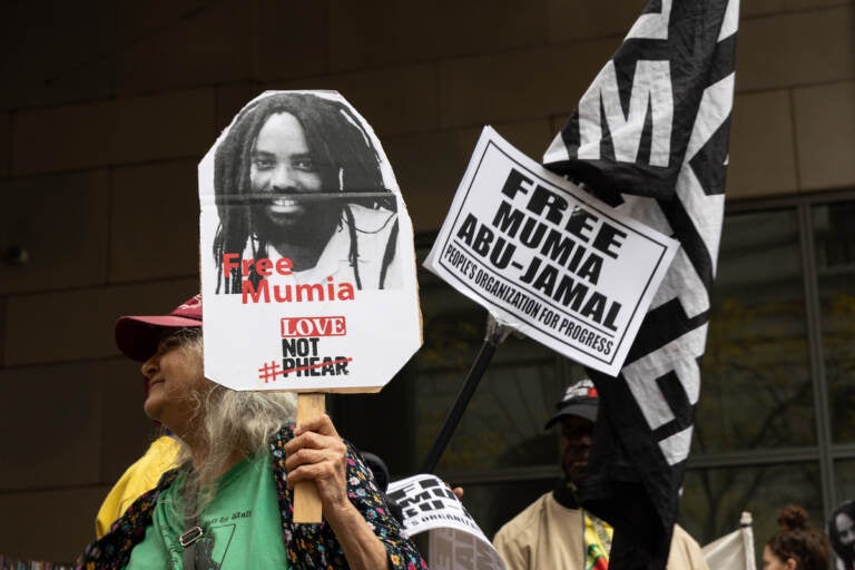 Supporters rallied outside the Criminal Justice Center during a hearing on Oct. 26, 2022 to determine if Mumia Abu-Jamal, convicted in the 1981 murder of police office Daniel Faulkner, would receive a new trial. (Kimberly Paynter/WHYY)