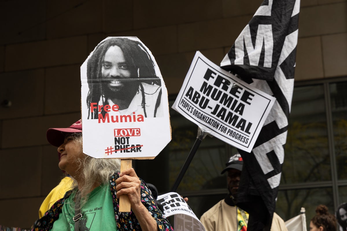 Supporters rallied outside the Criminal Justice Center during a hearing on Oct. 26, 2022 to determine if Mumia Abu-Jamal, convicted in the 1981 murder of police office Daniel Faulkner, would receive a new trial. (Kimberly Paynter/WHYY)