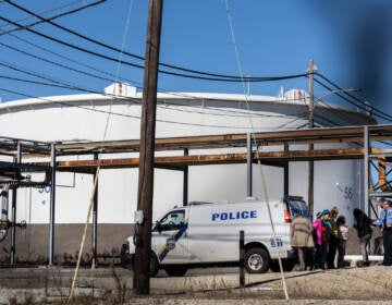 Seven protesters were arrested for hopping the fence to a restricted area of the Southwest Philadelphia oil tank farm during a protest on Oct. 27, 2022. (Kimberly Paynter/WHYY)