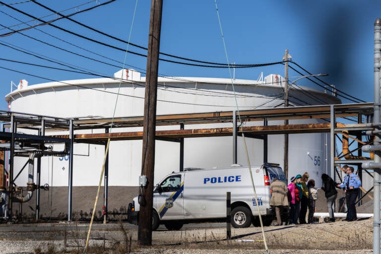 Seven protesters were arrested for hopping the fence to a restricted area of the Southwest Philadelphia oil tank farm during a protest on Oct. 27, 2022. (Kimberly Paynter/WHYY)