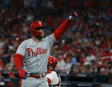 Philadelphia Phillies' Bryce Harper reacts after hitting a solo home run during the second inning in Game 2 of a National League wild-card baseball playoff series against the St. Louis Cardinals, Saturday, Oct. 8, 2022, in St. Louis. (AP Photo/Scott Kane)