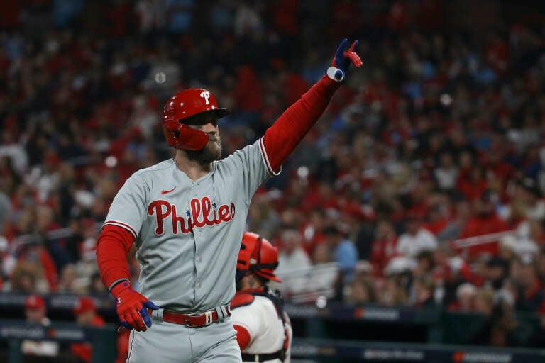 Philadelphia Phillies' Bryce Harper reacts after hitting a solo home run during the second inning in Game 2 of a National League wild-card baseball playoff series against the St. Louis Cardinals, Saturday, Oct. 8, 2022, in St. Louis. (AP Photo/Scott Kane)