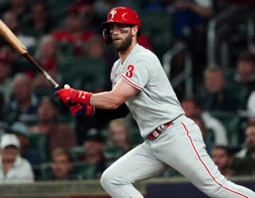 Philadelphia Phillies designated hitter Bryce Harper (3) hits a double during the second inning in Game 2 of baseball's National League Division Series between the Atlanta Braves and the Philadelphia Phillies, Wednesday, Oct. 12, 2022, in Atlanta. (AP Photo/John Bazemore)