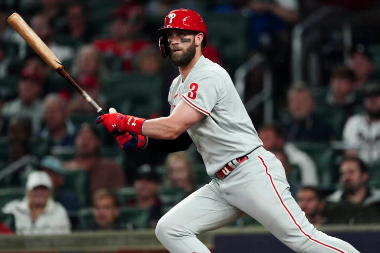 Philadelphia Phillies designated hitter Bryce Harper (3) hits a double during the second inning in Game 2 of baseball's National League Division Series between the Atlanta Braves and the Philadelphia Phillies, Wednesday, Oct. 12, 2022, in Atlanta. (AP Photo/John Bazemore)