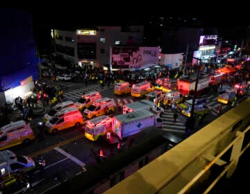 Ambulances and emergency responders are visible from above.