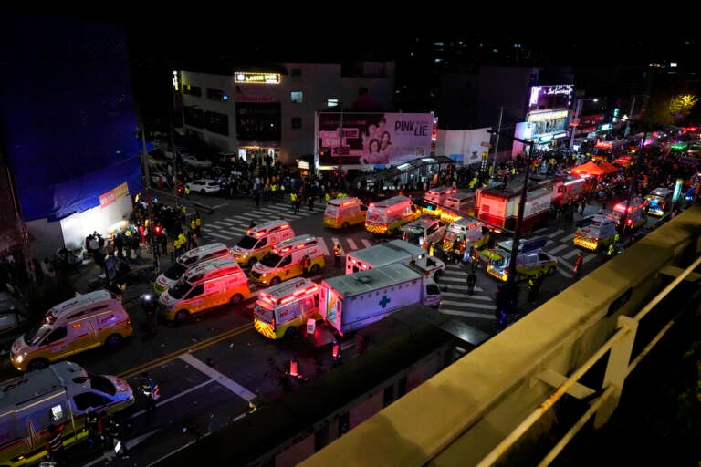 Ambulances and emergency responders are visible from above.