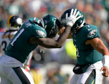 Philadelphia Eagles wide receiver A.J. Brown (11) celebrates his third touchdown reception with quarterback Jalen Hurts during the first half of an NFL football game between the Pittsburgh Steelers and Philadelphia Eagles, Sunday, Oct. 30, 2022, in Philadelphia. (AP Photo/Matt Slocum)