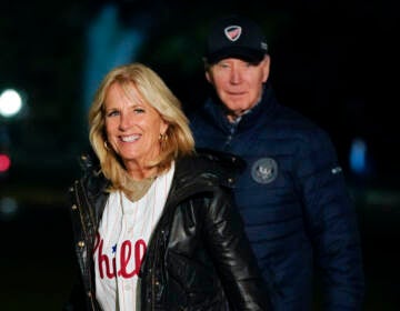 File photo: First lady Jill Biden wears a Philadelphia Phillies jersey as she and President Joe Biden walk on the South Lawn of the White House after stepping off Marine One, Oct. 23, 2022, in Washington.  (AP Photo/Patrick Semansky, File)