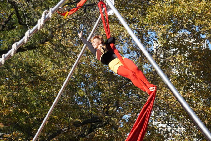 Aerial tricks at the Pumpkinfest performance stage. (Sam Searles/WHYY)