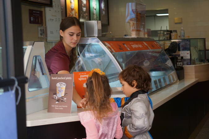 The South Street Häagen-Dazs hands out candy as part of Pumpkinfest. (Sam Searles/WHYY)