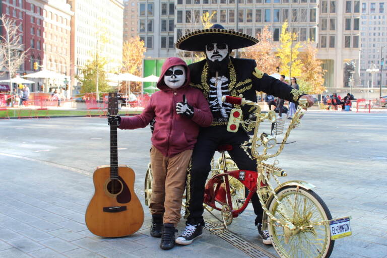 People who participated in a community bike ride on Sunday were encouraged to decorate their bicycles and to dress up as Catrinas or Calaveras. (Cory Sharber/WHYY)