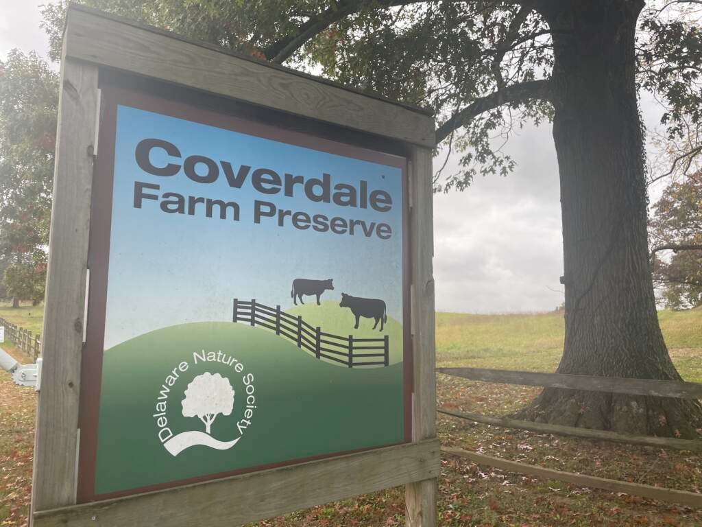 A sign reads, "Coverdale Farm Preserve." Trees and fields are visible in the background.