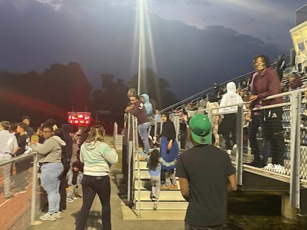 Most fans were all smiles for Friday Night Lights at Dickinson High. (Cris Barrish/WHYY)