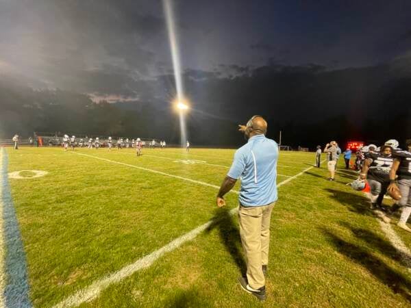 Dickinson head coach Duben Word exhorts his players to do better as they struggle during the 31-6 defeat. (Cris Barrish/WHYY)