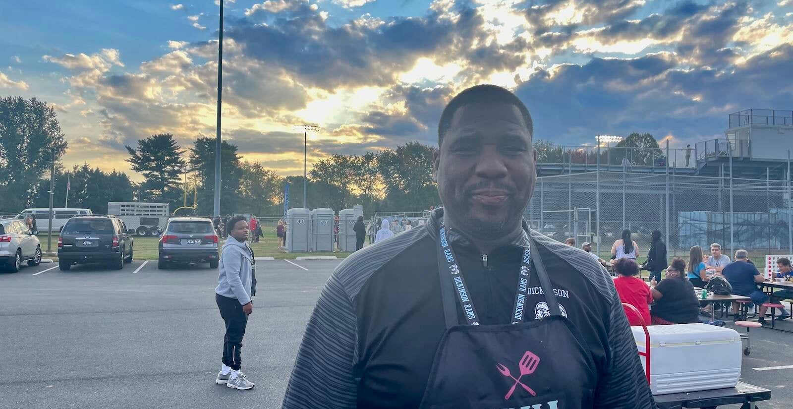 Dickinson High vice principal Robbie Johnson hosts a pre-game cookout for staff. (Cris Barrish/WHYY)