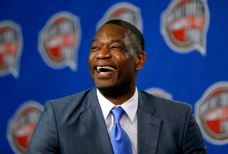 Close-up of Dikembe Mutombo smiling and laughing.