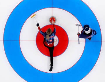 Victoria Persinger (left) and Christopher Plys of Team USA compete against Team Norway during the Curling Mixed Doubles Round Robin ahead of the Beijing 2022 Winter Olympics at the National Aquatics Center in Beijing on on Feb. 3. (Lintao Zhang/Getty Images)