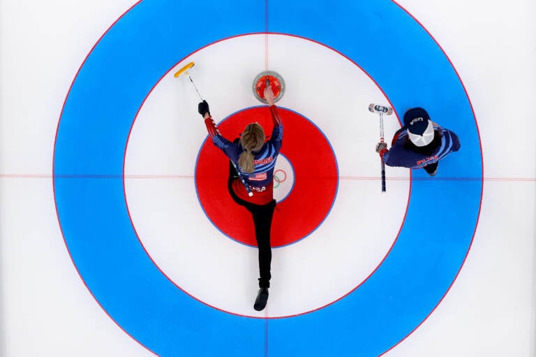 Victoria Persinger (left) and Christopher Plys of Team USA compete against Team Norway during the Curling Mixed Doubles Round Robin ahead of the Beijing 2022 Winter Olympics at the National Aquatics Center in Beijing on on Feb. 3. (Lintao Zhang/Getty Images)