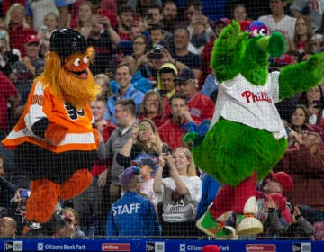 Gritty, the Philadelphia Flyers' mascot, left, and the Philly Phanatic dance during a baseball game