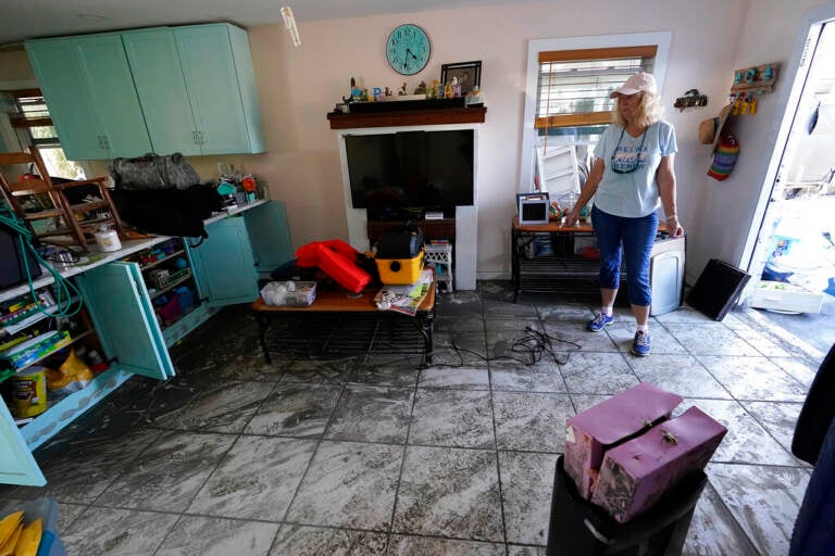 A person stands in the middle of a room.