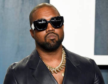 An up-close photo of Ye wearing sunglasses.