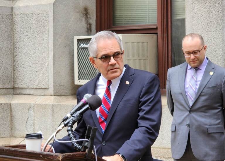 Krasner speaks from the podium.